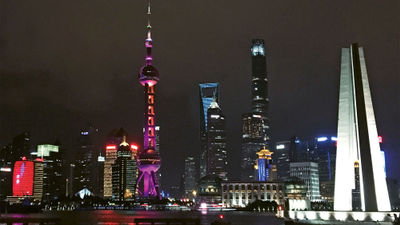The nighttime view of Shanghai’s Pudong district from the Bund waterfront area.