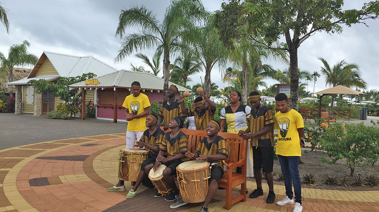 Norwegian Cruise Line spent 31 months building Harvest Caye, a 55-acre private port attraction in southern Belize. When passengers arrive onshore they are greeted by an Afro-Caribbean band playing drums and percussion instruments and singing songs native to the Garifuna, an ethnic sub-group in Belize.