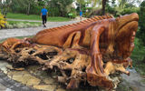 An iguana sculpted out of a large piece of driftwood decorates the shopping village.