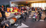 Taiko drummers call the grand opening celebration to commence.