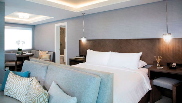The two penthouse suites at Ikona feature a tastefully appointed great room compete with dining table, king-size bed, sofa and kitchenette. The two penthouse suites at Ikona feature a tastefully appointed great room compete with dining table, king-size bed, sofa and kitchenette.