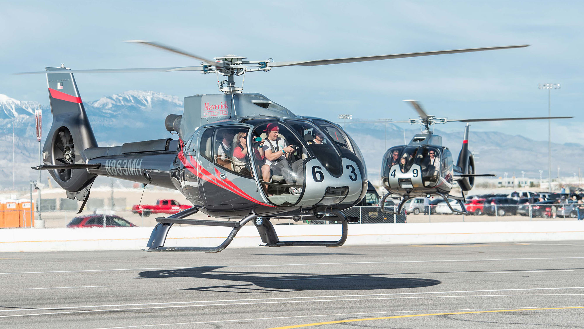 Fans arrive at the Las Vegas Motor Speedway on service from Maverick Helicopters for the annual NASCAR weekend.