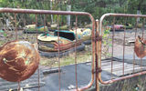 Bumper cars, never driven by children, lay rusting in Pripyat's amusement park, which was scheduled to open four days after the nuclear accident.