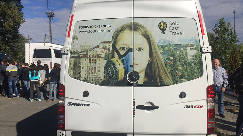 Tourists have been going to Chernobyl, the site of the worst nuclear accident in history, for 20 years. In 2015 alone, about 25,000 people visited the site. Chernobyl Tour, one of the operators offering guided excursions, acknowledges that it cannot guarantee that a visit to the area is completely risk-free, but makes a credible case that unless one breaks the rules or is very, very unlucky, the typical exposure to radiation on the tours is well below danger levels. Pictured here, a tour bus parked at the border of the Chernobyl Exclusion Zone, its passengers waiting for clearance to enter.