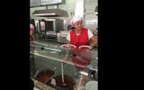 A cook at the Chernobyl canteen, ladling borscht to workers and tourists.