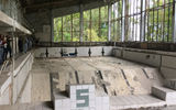 A swimming pool in Pripyat's main recreational center. According to a tour guide, the glass was removed in order to recycle the metal window frames.