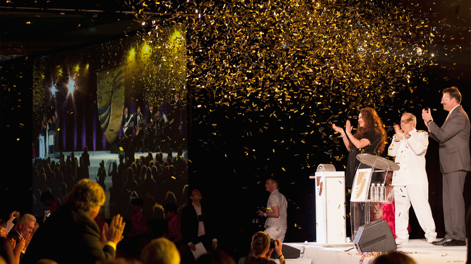 On the dais during the Seabourn Encore's christening were (from left) godmother Sarah Brightman, ship captain Mark Dexter and Seabourn president Rick Meadows.