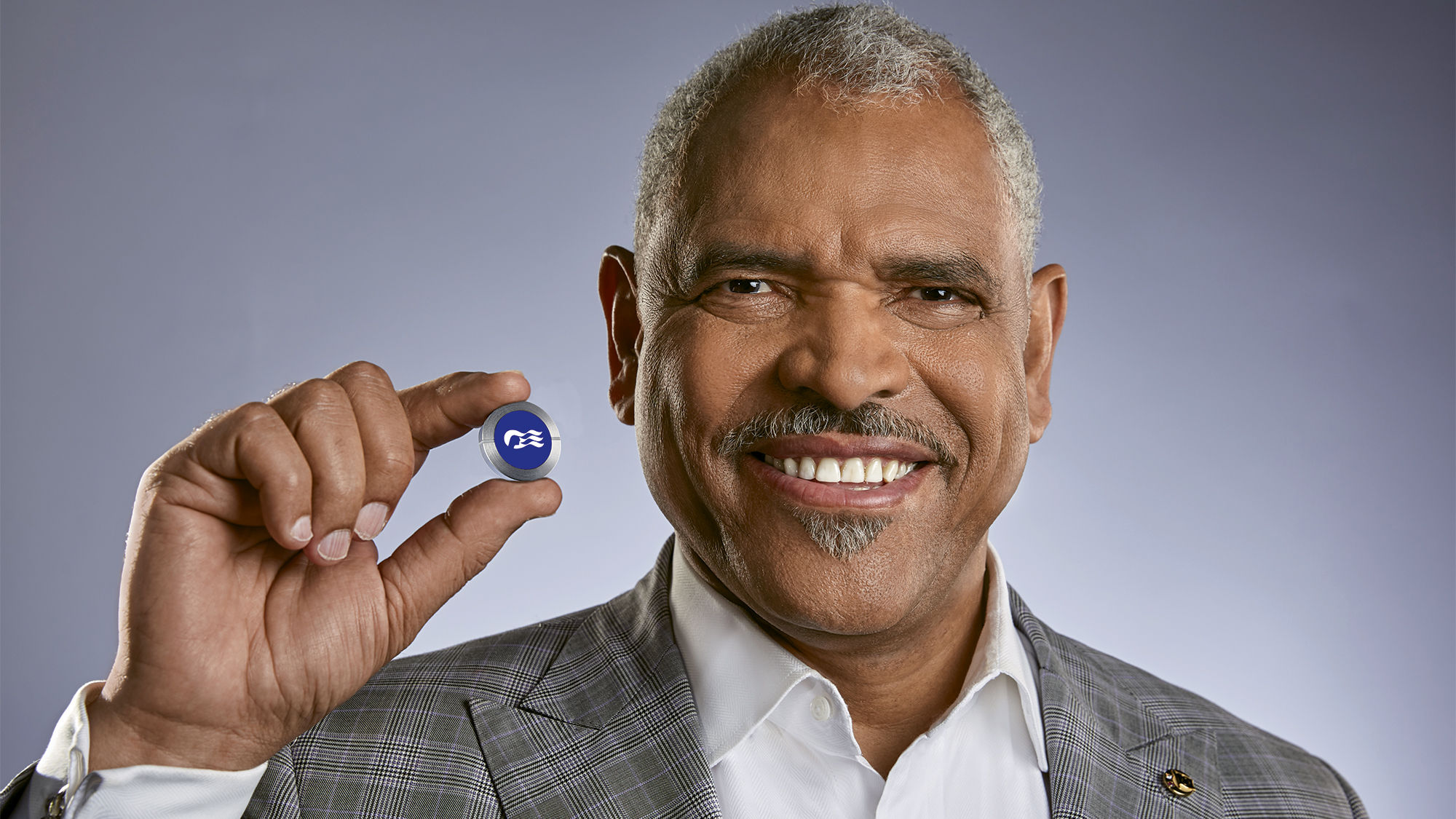 Carnival Corp. CEO Arnold Donald with the Ocean Medallion.