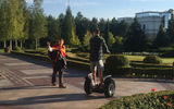 Outside the mansion, Oliynyk gives directions to a visitor navigating the 500 acres of Mezhyhirya on a Segway.