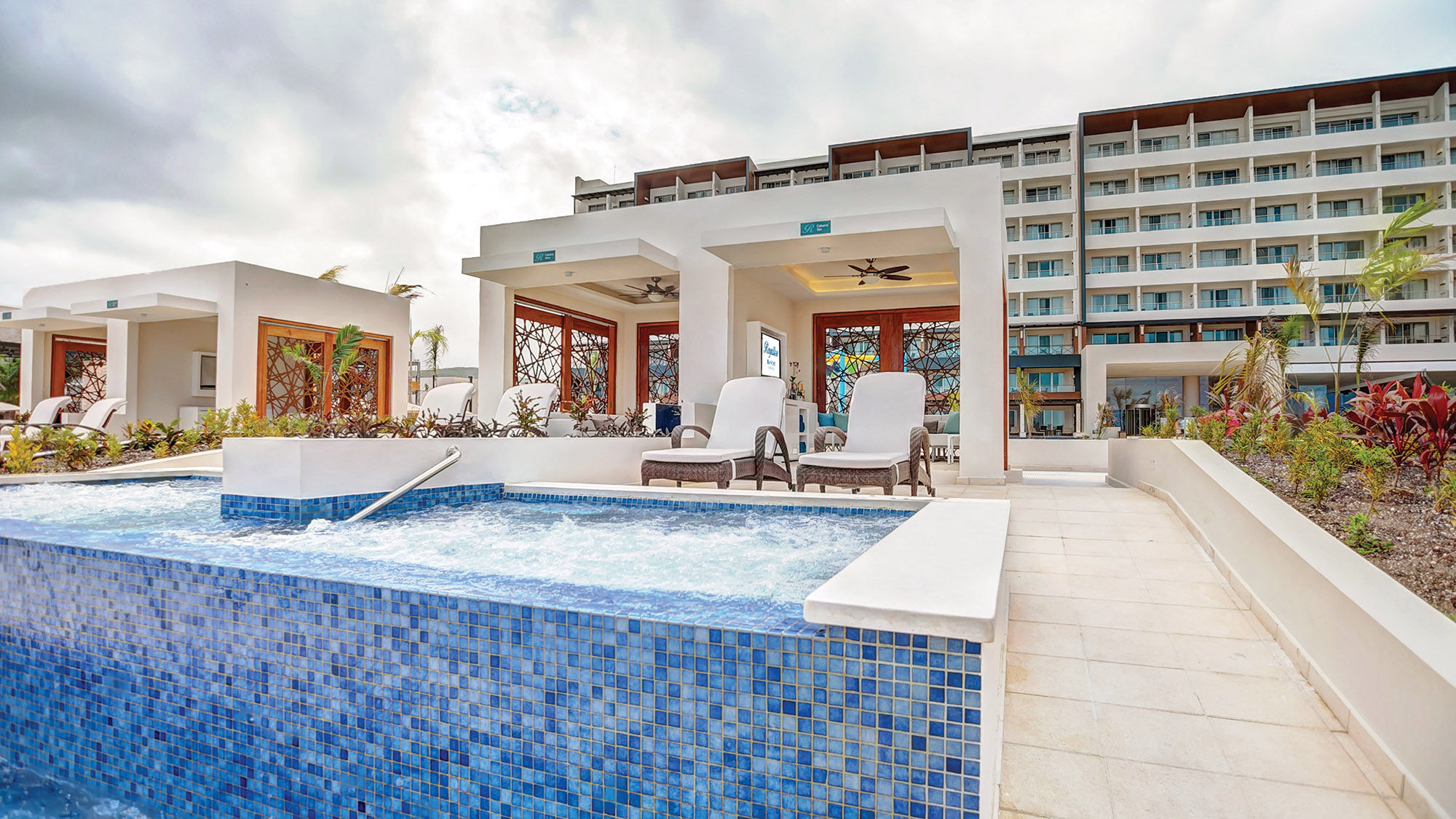 Poolside cabanas at the Royalton Blue Waters feature poolside cabanas with WiFi, a TV and a plunge pool.