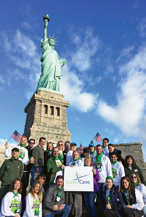 Volunteers for November’s Tourism Cares event in front of the Statue of Liberty. Volunteers mulched more than 60,000 cubic feet, protecting nearly 300 trees and other plant life there and at Liberty State Park in Jersey City, N.J. Volunteers for November’s Tourism Cares event in front of the Statue of Liberty. Volunteers mulched more than 60,000 cubic feet, protecting nearly 300 trees and other plant life there and at Liberty State Park in Jersey City, N.J.