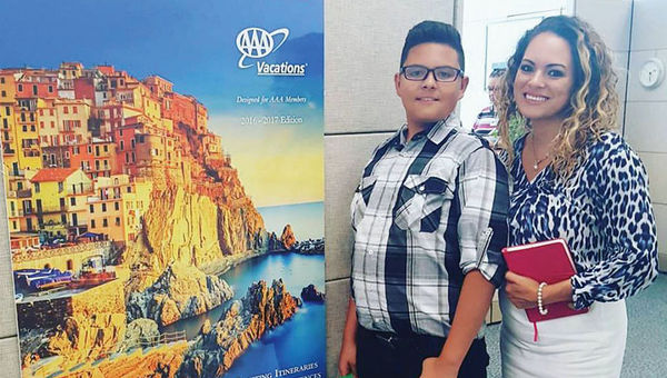 Brenda Urias, an Academy of Hospitality and Tourism graduate and manager at AAA, with her son, Diego, at her office. Brenda Urias, an Academy of Hospitality and Tourism graduate and manager at AAA, with her son, Diego, at her office.