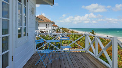 The bungalows offer 16-foot ceilings, private verandahs overlooking the beach.