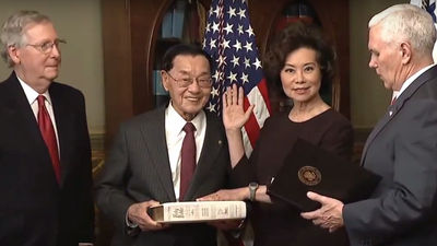Elaine Chao is sworn in as transportation secretary by Vice President Mike Pence (right). From left, Chao's husband Sen. Mitch McConnell and her father James Chao.