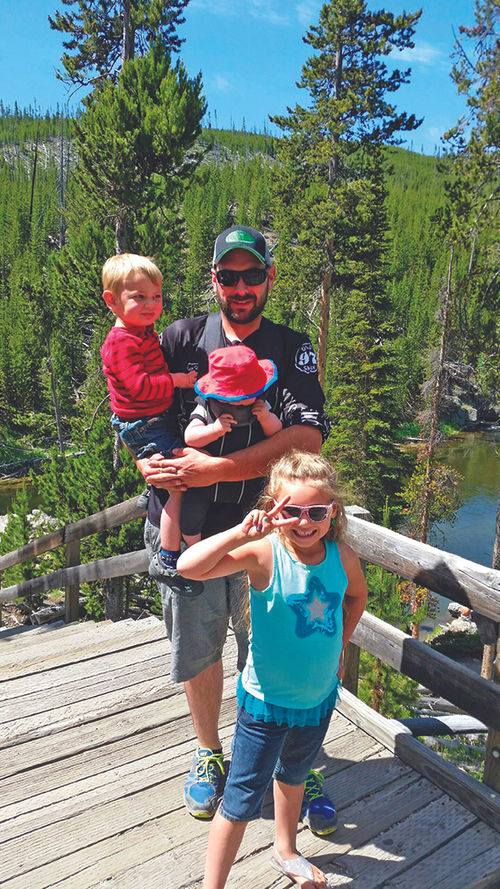Daniel Lakey and his kids on a Yellowstone vacation. His sister, Lesley Egbert, owner of the Live Longitude agency in Montana, helped plan the family trip.