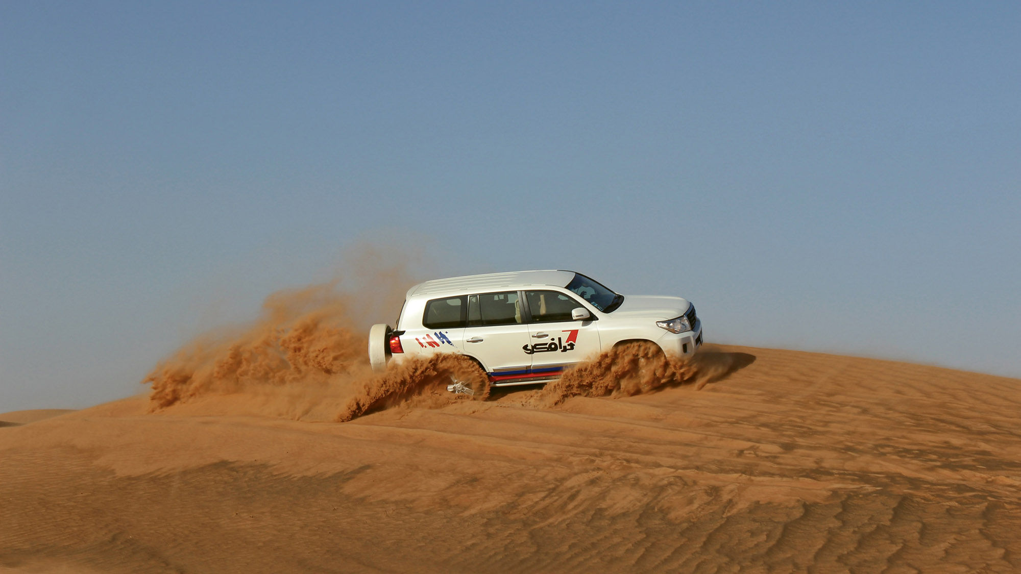 Dune bashing outside Dubai in a Land Cruiser. The experience lasts about 45 minutes and starts at about $80 for adults.