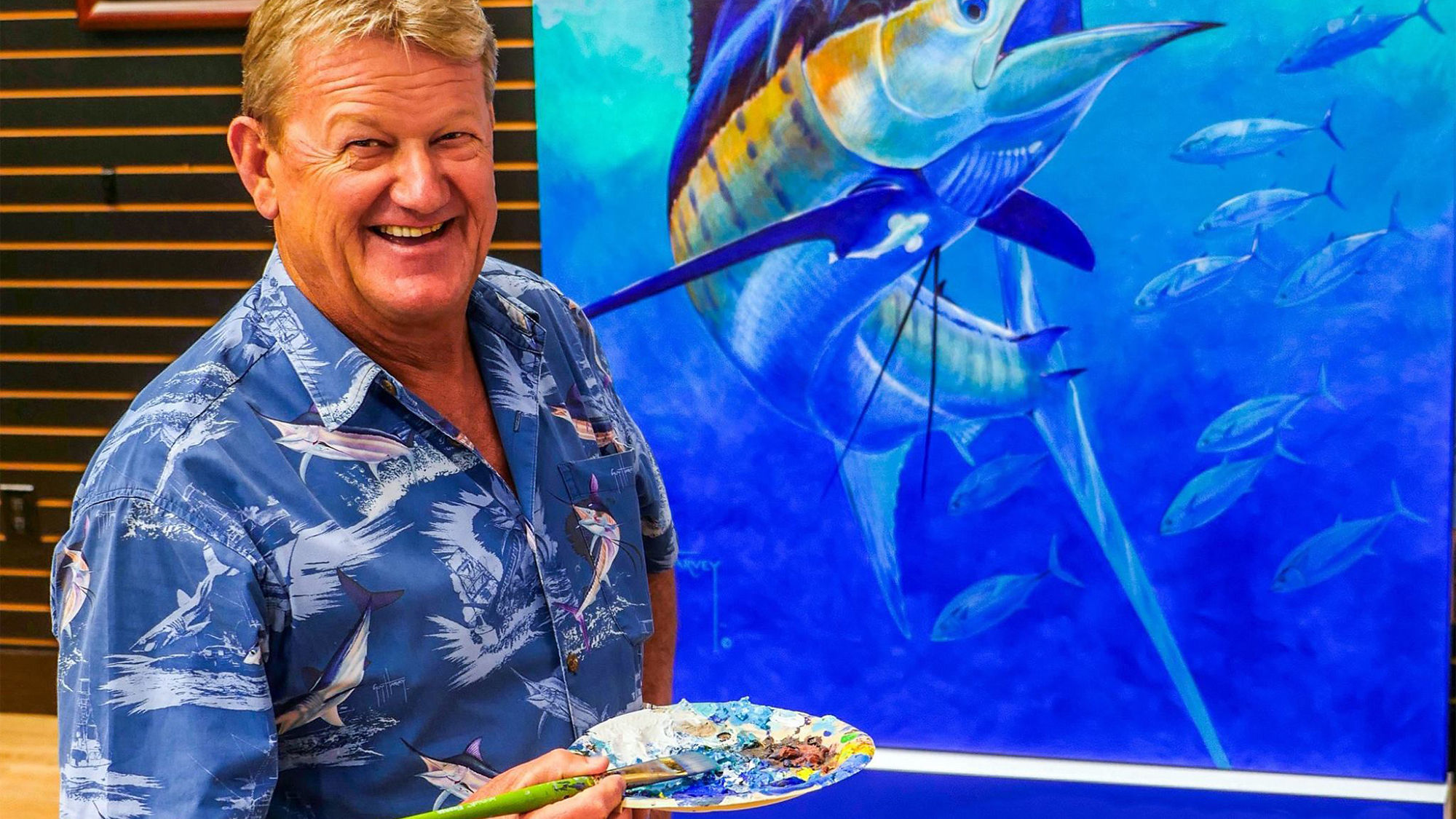 Guy Harvey, a nautical artist and ocean conservation specialist, painted the hull on the Norwegian Escape.