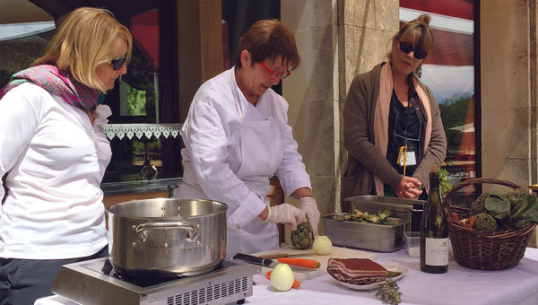 A demonstration by Michelin-star chef Reine Sammut (center), as as Oceania chef instructor Noelle Barille (left) and local guide Caroline Rocca (right) look on. A demonstration by Michelin-star chef Reine Sammut (center), as as Oceania chef instructor Noelle Barille (left) and local guide Caroline Rocca (right) look on.