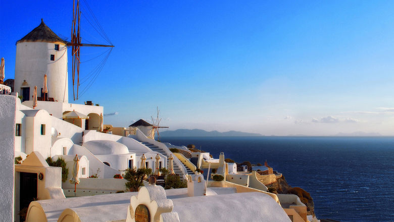 Windmills in Oia, on Santorini. Perillo's new Deluxe Greece 2023 tour will spend three nights on the island.