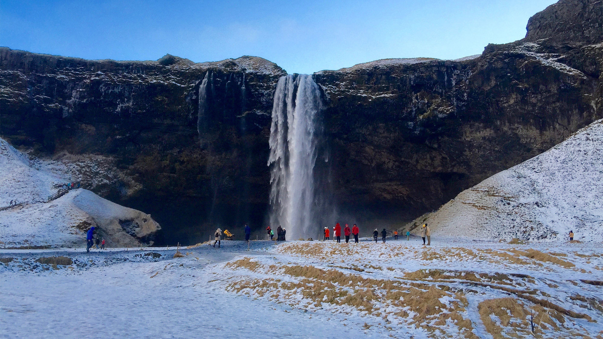 Tourists flock to the Rangarping Eystra waterfall in southern Iceland.