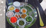 A tray is prepped for a cooking lesson on the beach on Konotta.