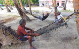 A hammock-culture prevails on Fiyoaree, where some men retreat from the midday sun to pass the time under the shade of palm trees.