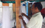 A Nadalla fisherman repairs his nets.