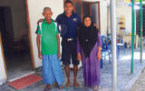 Simo Ali, the watersports manager at Konotta, also doubles as an excursions guide; he poses with his parents at their home on Fiyoaree, the first stop on his tours.