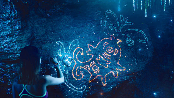 TapuTapu wearables at Universal Orlando Resort’s Volcano Bay waterpark will unlock experiences throughout the park, such as illuminating images in the caves of the park’s volcano.