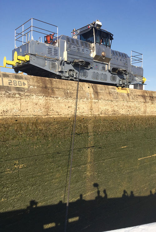 An electric locomotive “mule” attached to the Star Pride to pull it through one of the locks in the canal and minimize the chances for accidents. An electric locomotive “mule” attached to the Star Pride to pull it through one of the locks in the canal and minimize the chances for accidents.