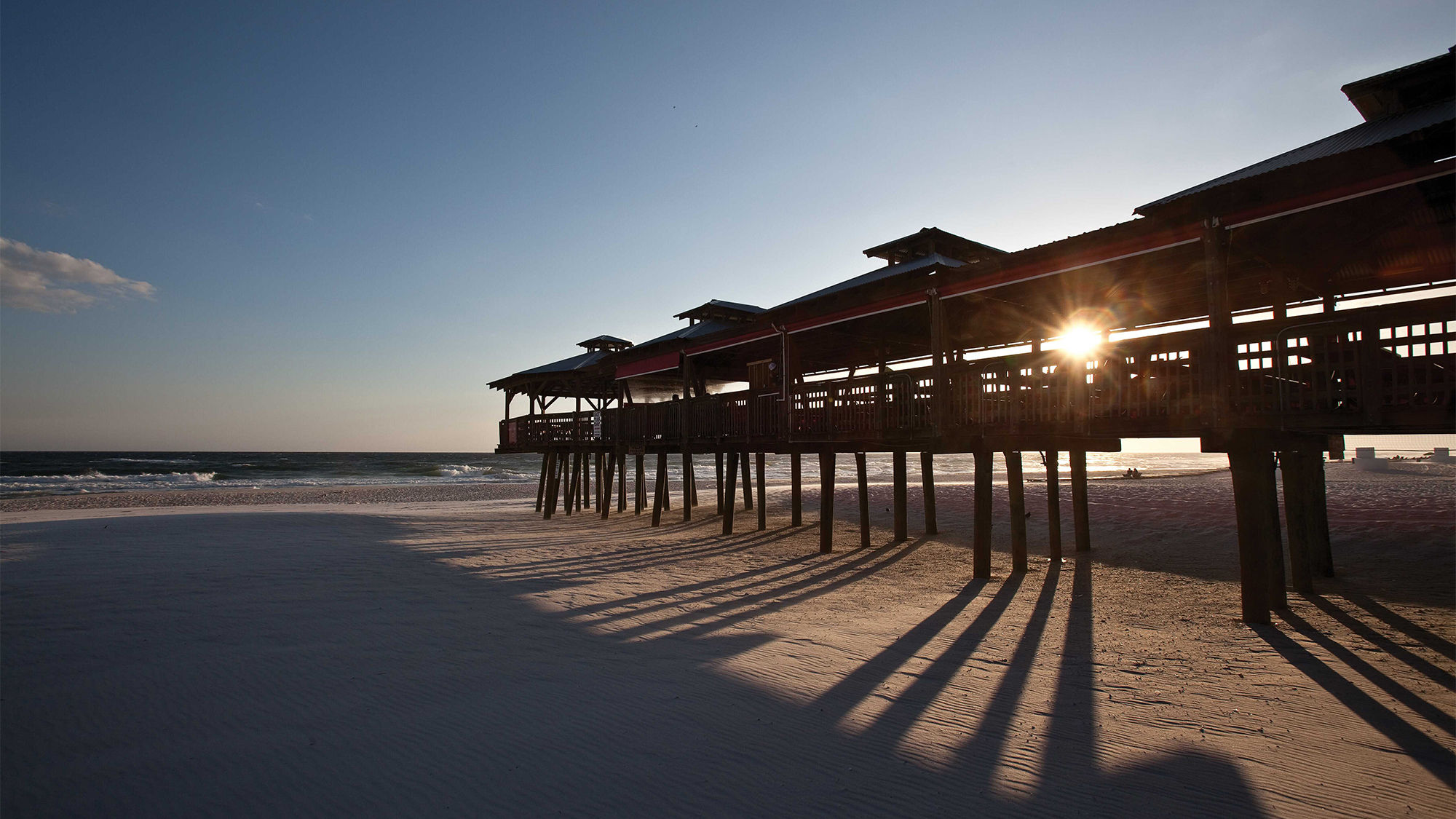 A pier at sunset on Panama City Beach.