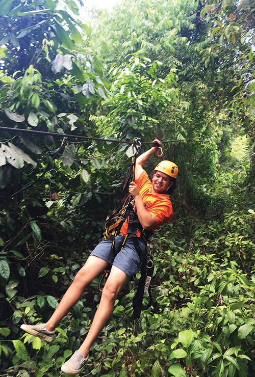 A guide ziplines through the canopy of the rain forest in Corcovado National Park. A guide ziplines through the canopy of the rain forest in Corcovado National Park.