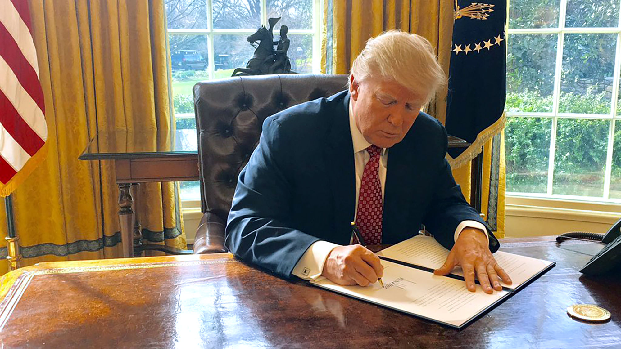 President Trump on Monday signed a revised executive order for a 90-day ban on travel from six countries in the Middle East and Africa.