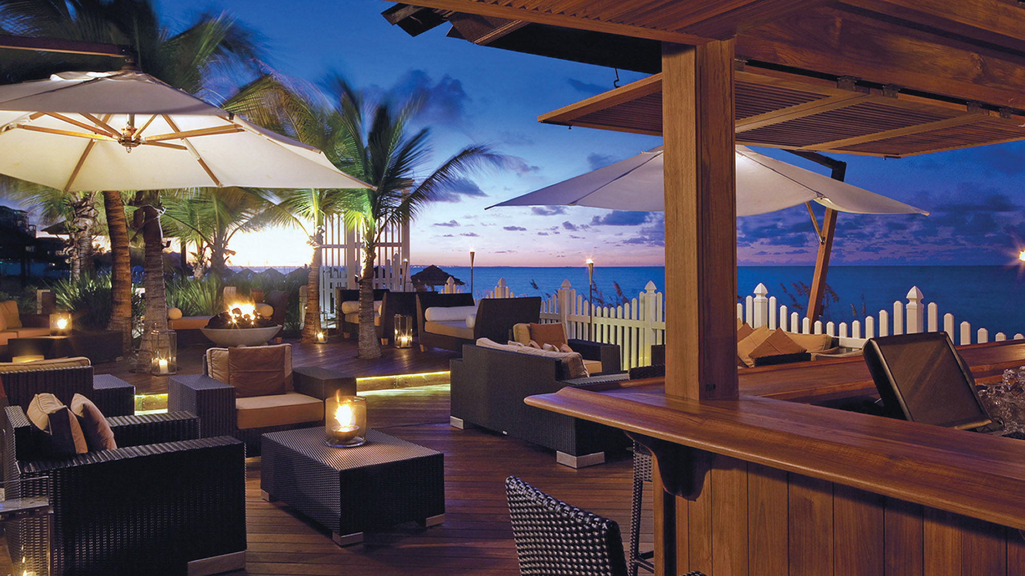 Casual dining and Caribbean cocktails await guests at the Deck at the Seven Stars Resort & Spa in Turks and Caicos.