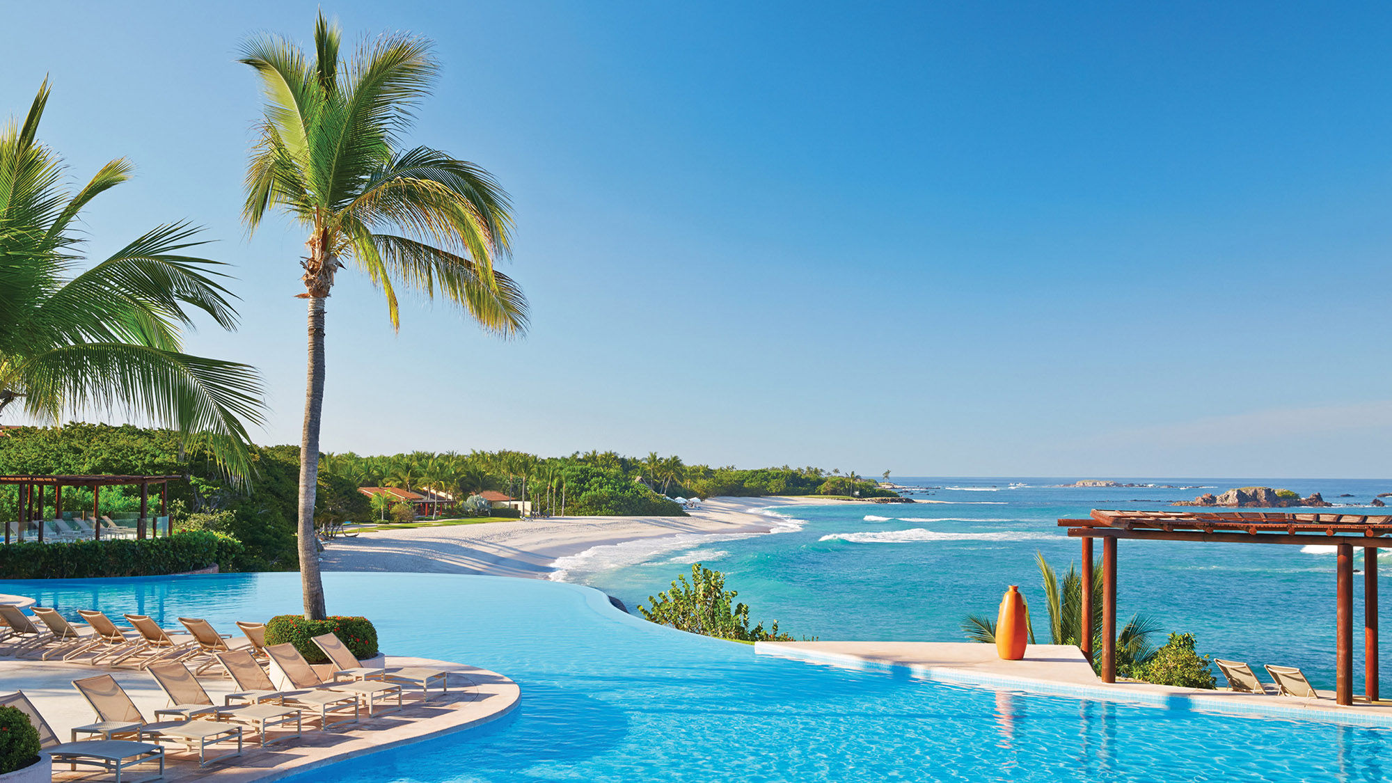 The free-form infinity pool at the Four Seasons Punta Mita is a spot to settle in for activities or just relax.