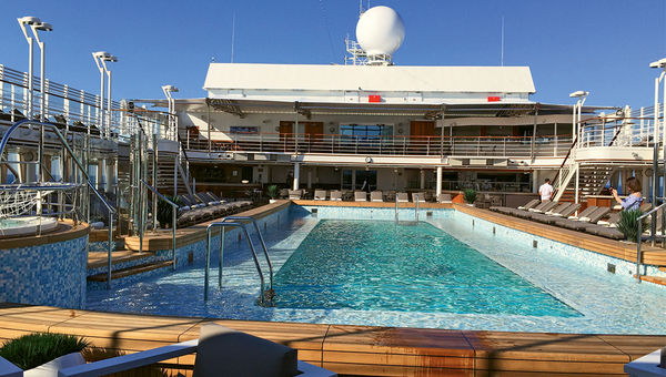 The long swimming pool helps lend a sense of expansiveness to the pool deck.