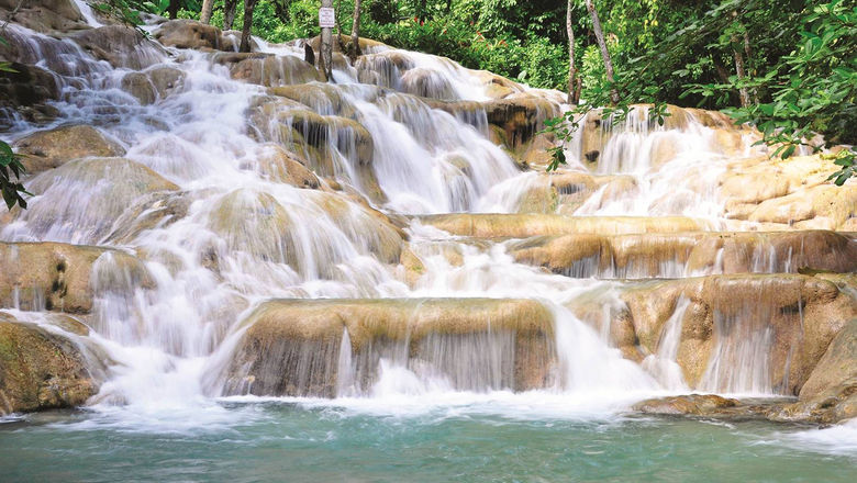 Dunn's River Falls in Ocho Rios, Jamaica. The island is lifting testing requirements and its indoor mask mandate this week.