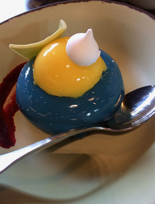 The blueberry cheesecake mousse wth passionfruit topping at Satu'li Canteen is inspired by the face of the Na'vi: blue with white speckles and bright yellow eyes.