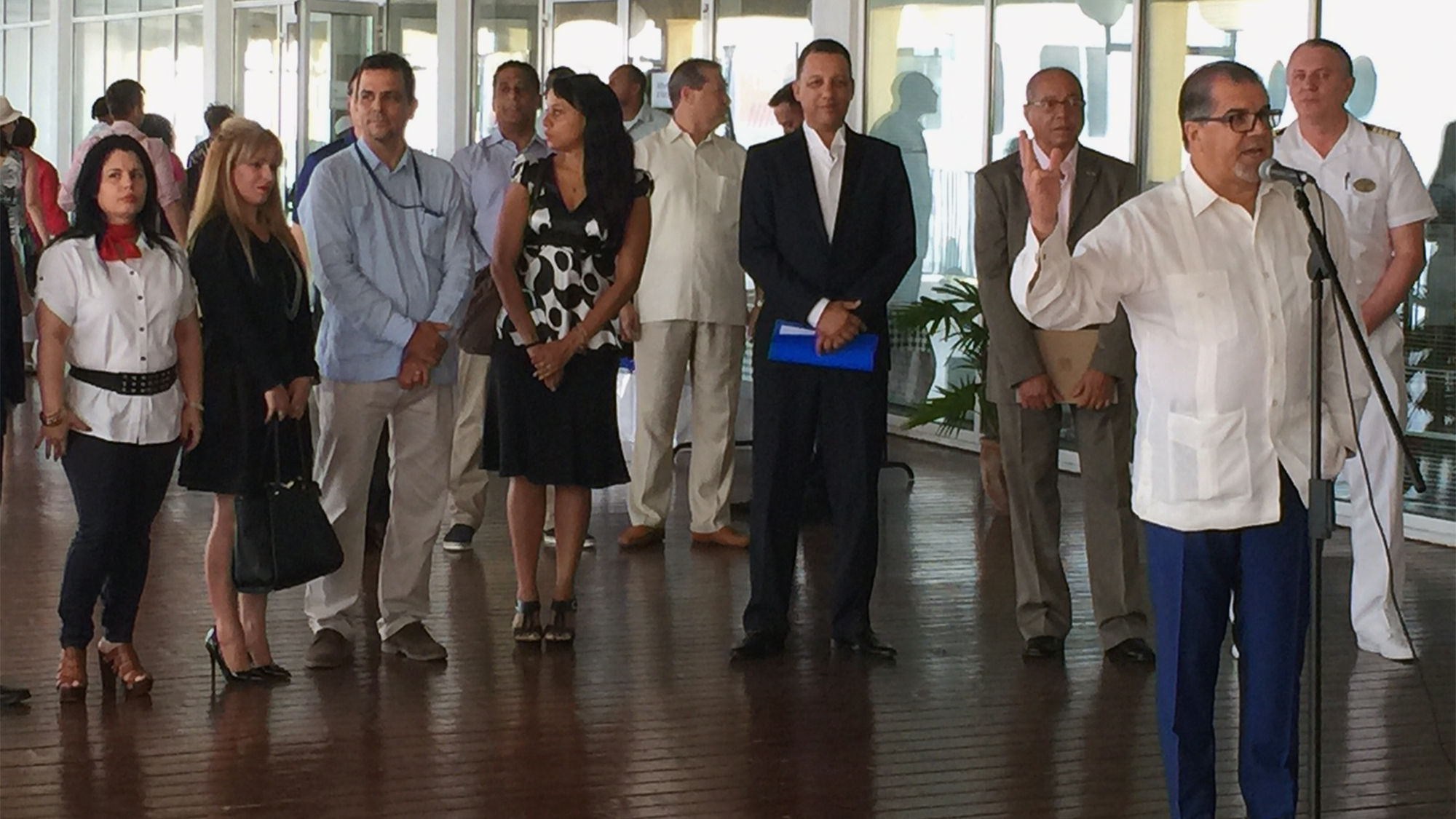 NCLH chairman Frank Del Rio addresses Cuban officials at the terminal in Havana.