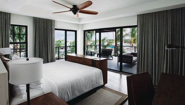 A Grand Suite bedroom with a view of the marina.