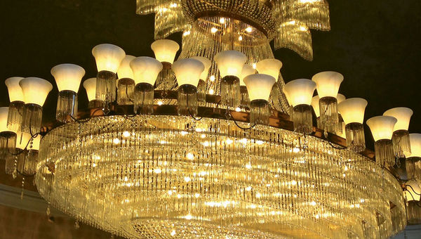The 4,000-pound Czech crystal chandelier in the Palm Court Lobby. Installed in 1961, the chandelier was dismantled, and all 7,000 crystal pieces were removed and cleaned.