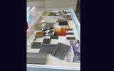 A display case of fabrics and materials to be used in the design of the Retreat, a relaxation area for suite guests onboard Edge-class vessels.