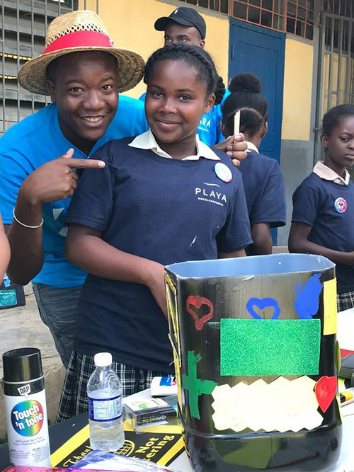 A Playa employee and a student at the Granville school collaborate on an art project. A Playa employee and a student at the Granville school collaborate on an art project.