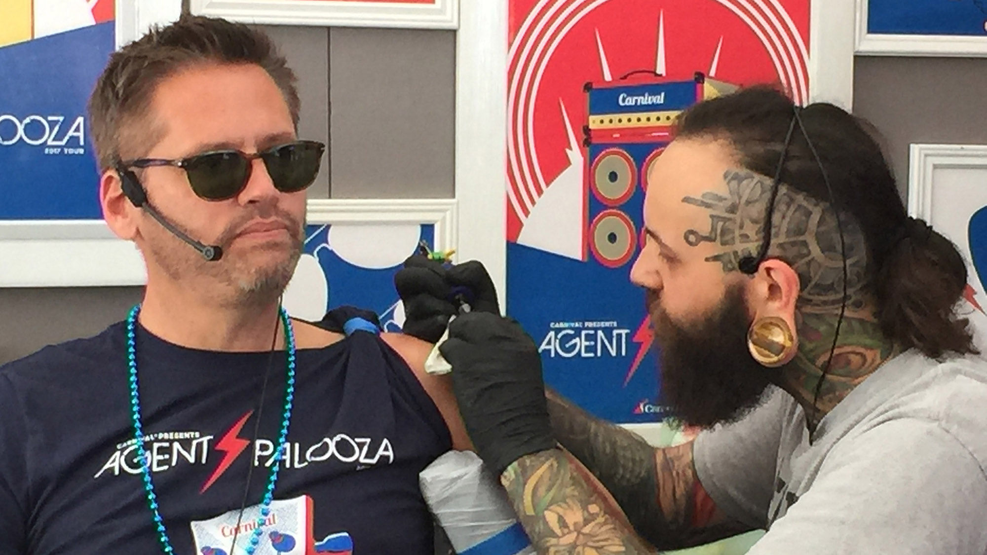 Carnival Cruise Line vice president Adolfo Perez gets a tattoo at Agentpalooza in New Orleans.