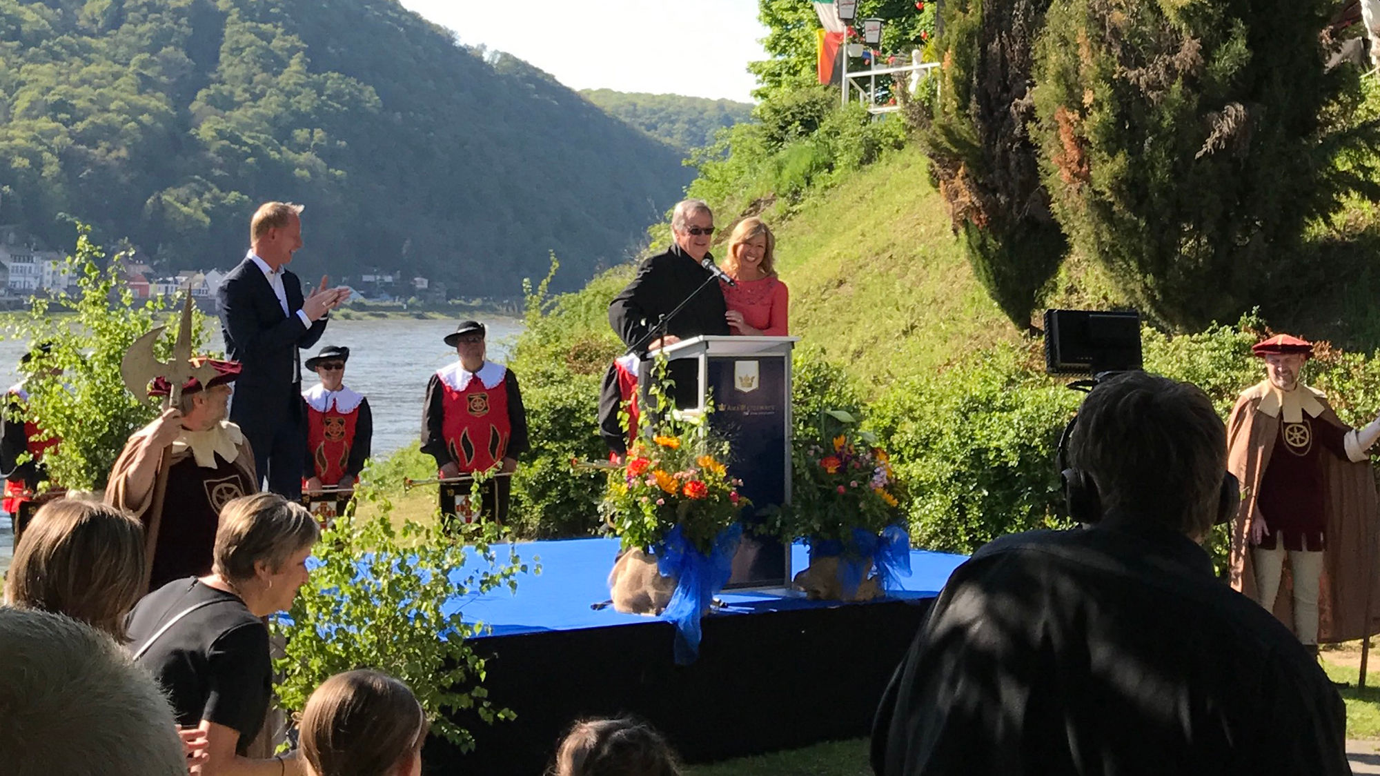 AmaWaterways' Rudi Schreiner and Kristen Karst at the podium during the naming of the AmaKristina. Certares joins Schreiner and Karst as an investor in the line.