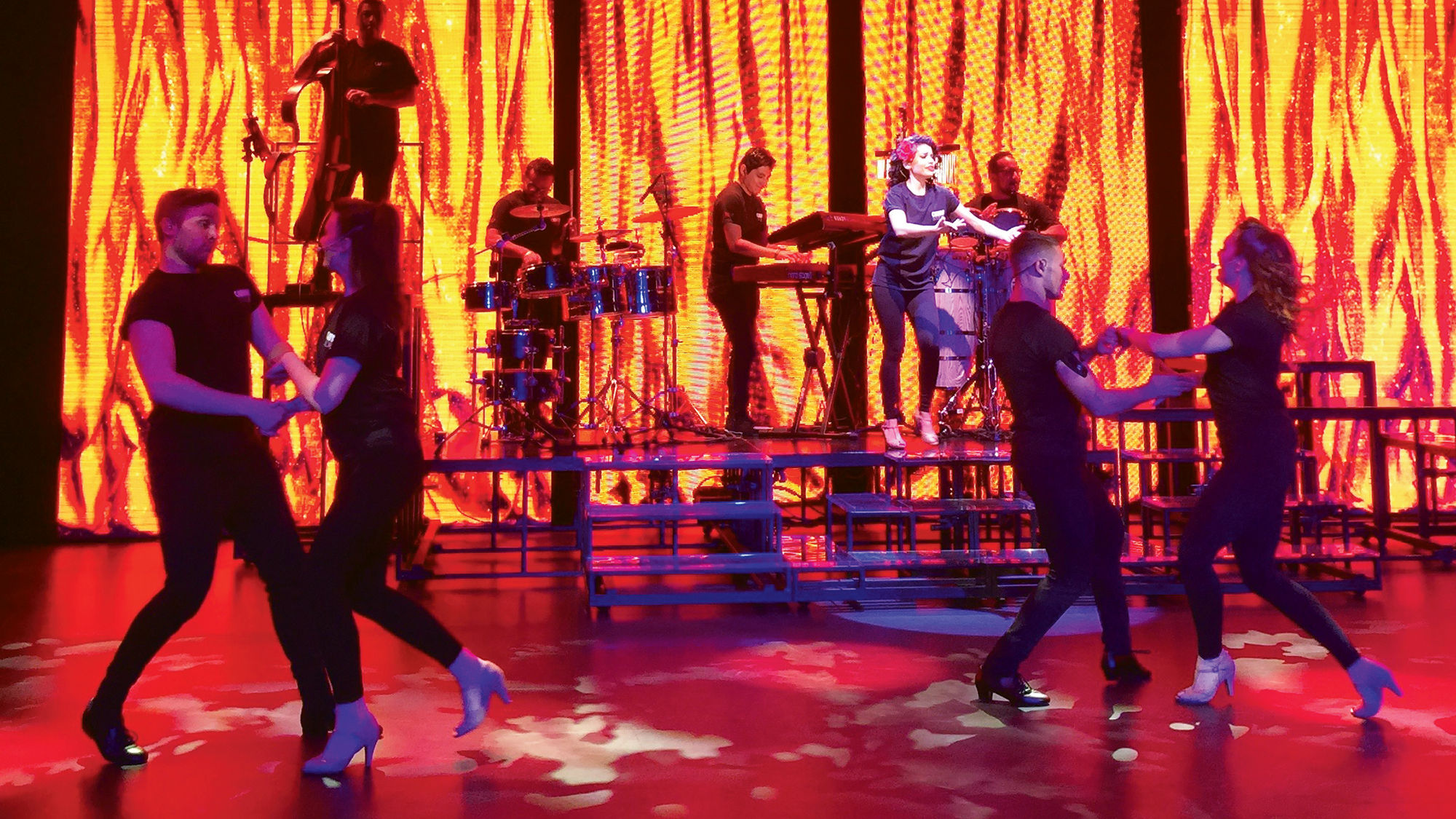 Dancers and musicians perform in "Amor Cubano" at the opening of Carnival Cruise Line's new rehearsal studio in Davie, Fla.