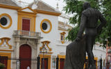 The Plaza de Toros in Seville, with a statue of matador Manolo Vazquez in the foreground.