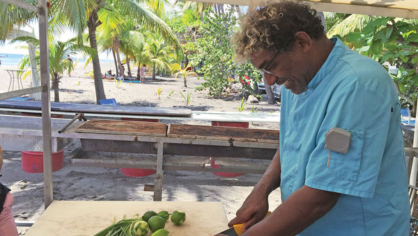 Chef Guy Ferdinand makes a ceviche from fresh marlin, scallions, lime and pepper at his beachfront restaurant, Le Petibonum. Chef Guy Ferdinand makes a ceviche from fresh marlin, scallions, lime and pepper at his beachfront restaurant, Le Petibonum.