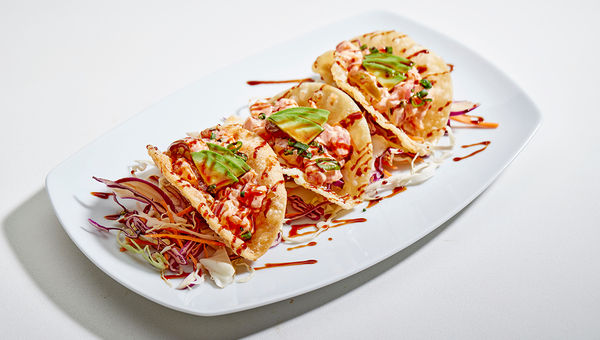 The spicy ahi wonton tacos at Leahi Concept Kitchen are served with local avocado, cherry tomato, and a fresh unagi sauce. The spicy ahi wonton tacos at Leahi Concept Kitchen are served with local avocado, cherry tomato, and a fresh unagi sauce.