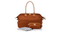 What's New, What's Hot is Travel Weekly's look at useful and fun travel gadgets, edited by Joe Rosen. First up, the Jemma Birdie Bag. This all-in-one tote features a soft Italian nylon exterior, a black and white nylon lining, front slip laptop pocket, large central compartment, water bottle holder, wallet and phone pockets, card slots, detachable key strap and back and side zipper pockets. In addition, the bag includes a ventilated exterior shoe compartment; an adjustable, removable cross-body strap; and a matching cosmetic case.